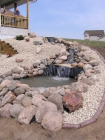 Pond and stream with multi-tiered waterfall