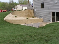 Two-level retaining wall and walkout entrance